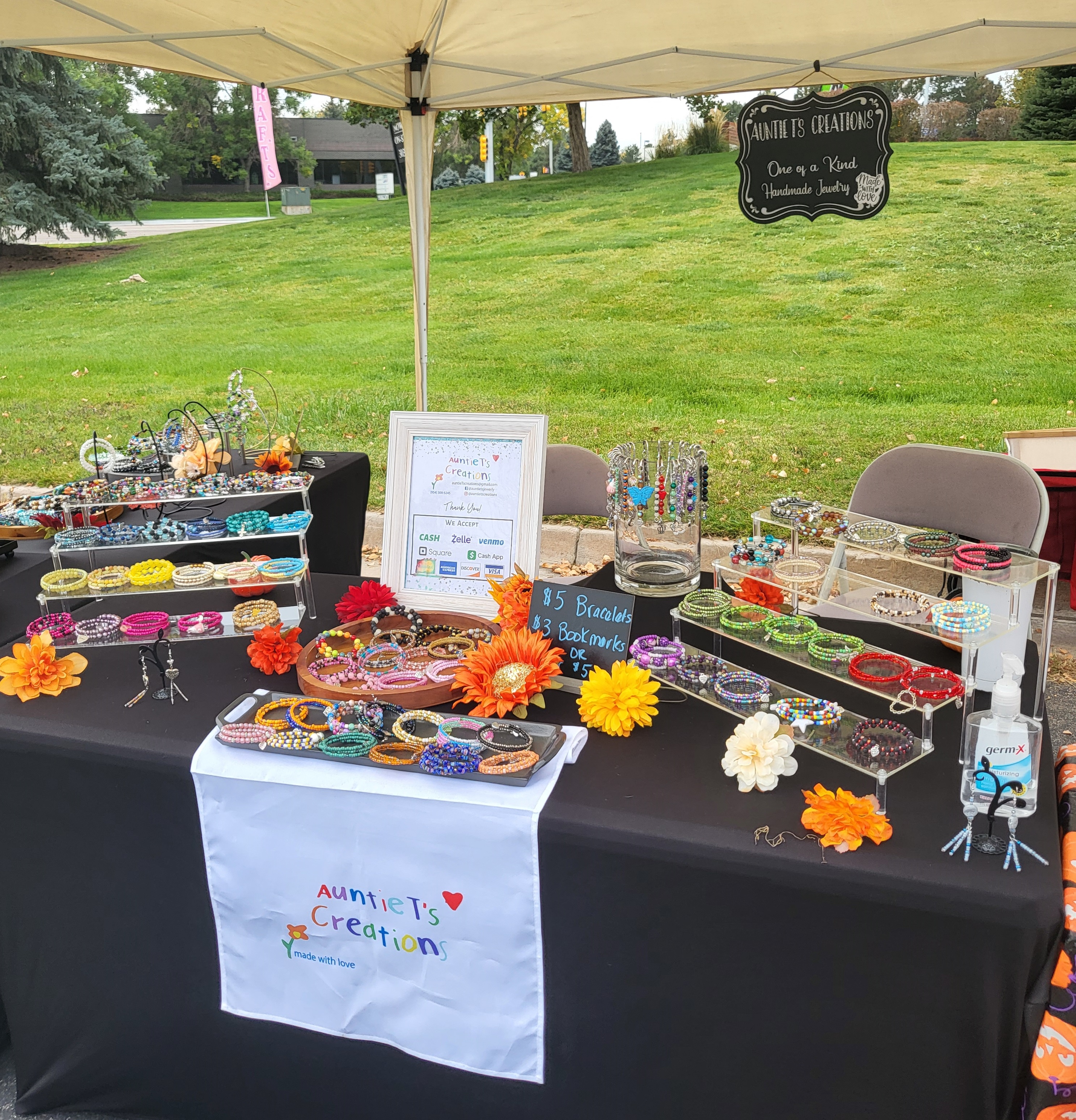 an Auntie T's booth at an outdoor craft fair
