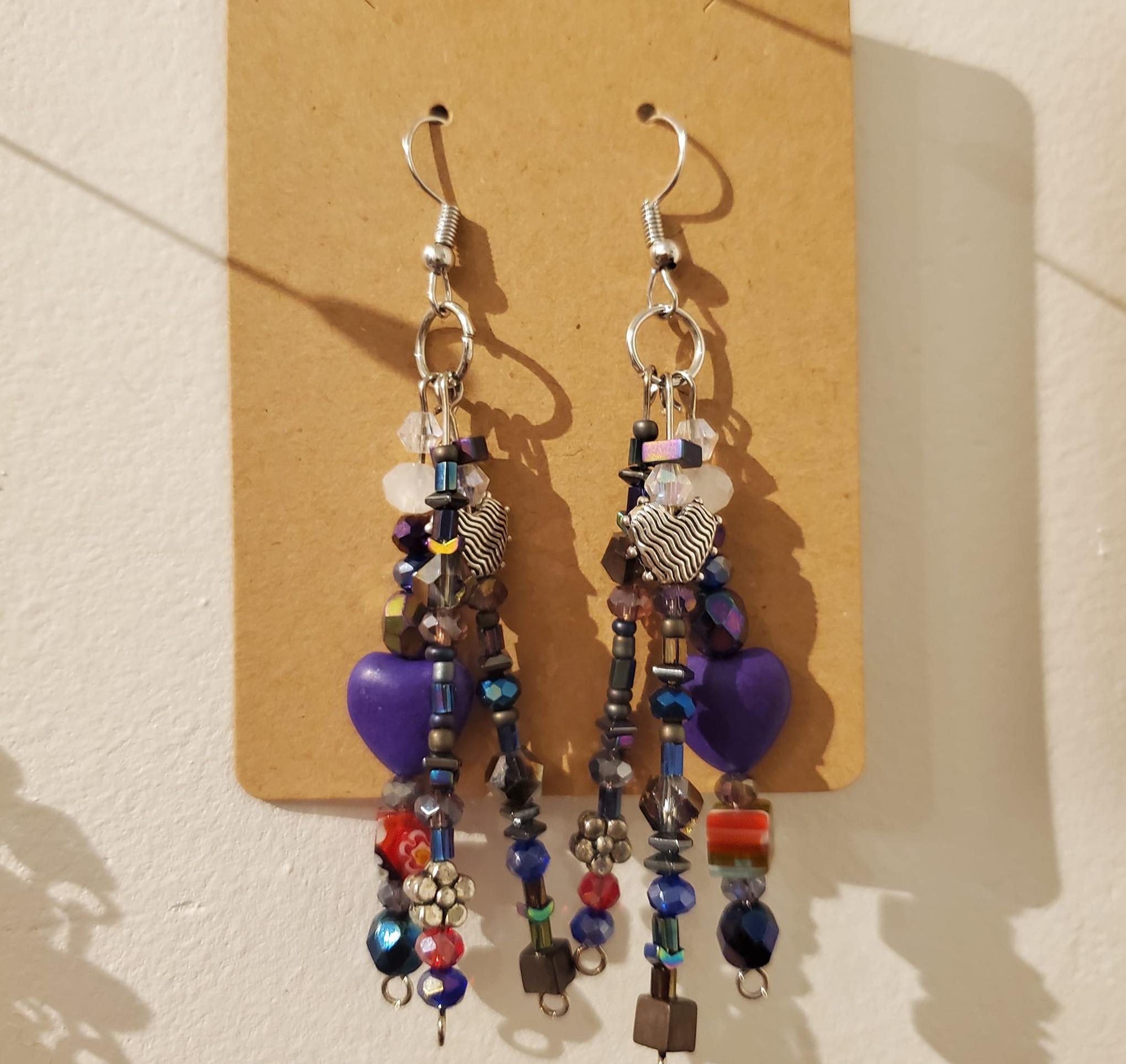 dangly earrings with many colorful beads
