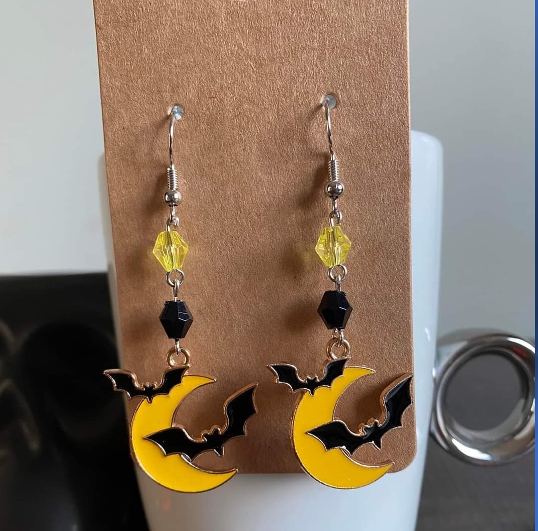 halloween earrings with a half moon and bat pendant